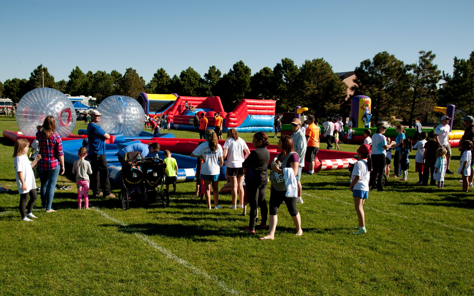 PETERSON AIR FORCE BASE, Colo. – Local military families attend Nickelodeon’s annual Worldwide Day of Play at Patriot Park, Sept. 26, 2015.  The event encouraged children to maintain healthy lifestyles through various activities including a climb wall, inflatable obstacle course, bounce houses, games, healthy snacks, a Color Run and demonstrations from the Peterson Fire Station and Mobile Emergency Operations Center. (U.S. Air Force photo by Senior Airman Tiffany DeNault)