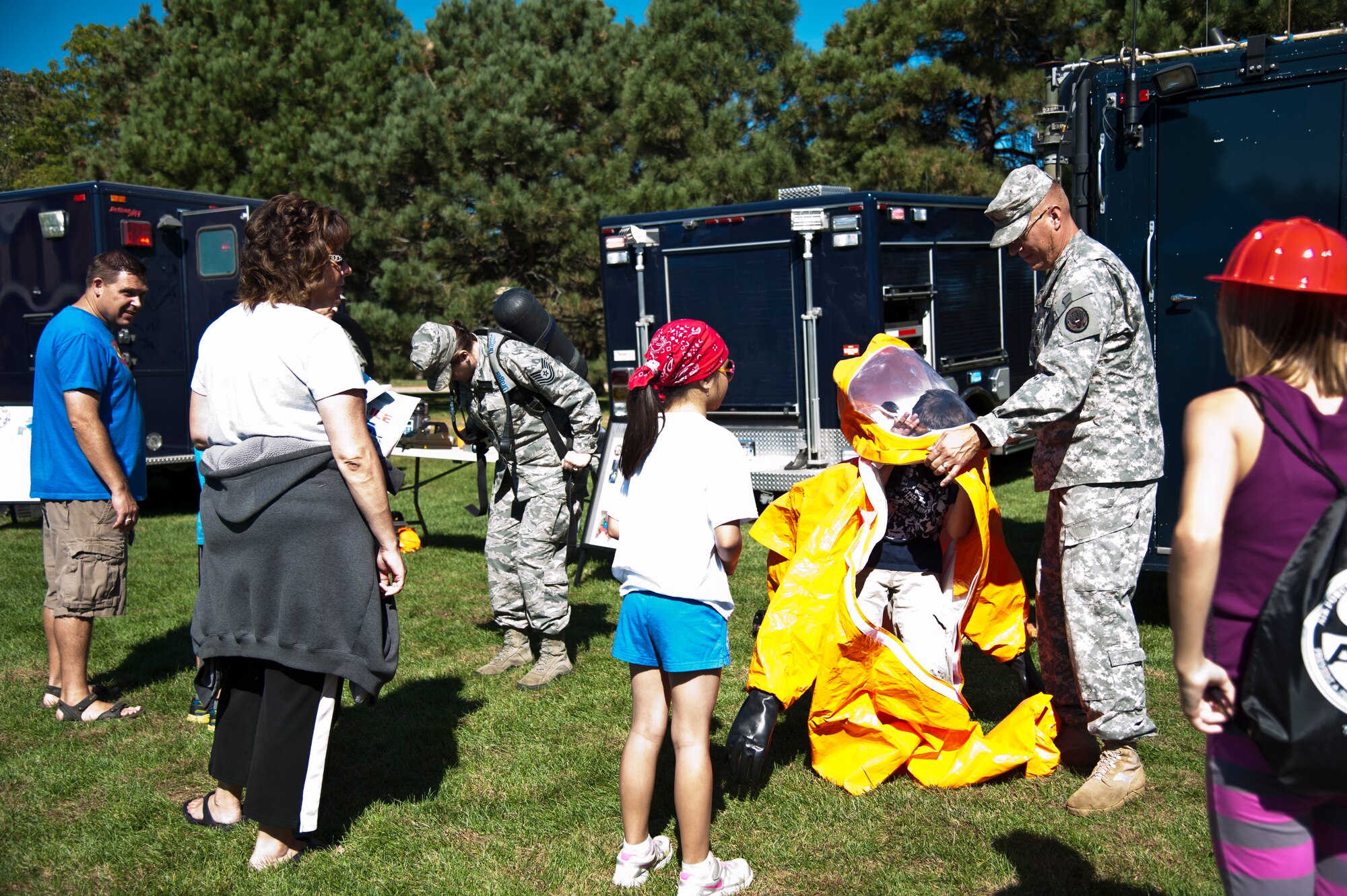 PETERSON AIR FORCE BASE, Colo. – Members of Colorado National Guard demonstrate equipment used in the event of a chemical, biological, radiological or nuclear disaster at Nickelodeon’s Worldwide Day of Play at Patriot Park, Sept. 26, 2015. The annual event included a Color Run, a healthy cooking challenge, inflatable obstacle courses, climbing wall, games, snacks, and demonstrations from the Peterson Fire Station and Mobile Emergency Operations Center. (U.S. Air Force photo by Senior Airman Tiffany DeNault)