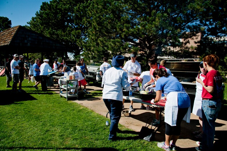 PETERSON AIR FORCE BASE, Colo. – Nickelodeon’s Worldwide Day of Play attendees participate in a cook off challenge at Patriot Park, Sept. 26, 2015. The participants were handed a “basket” of ingredients and were given 70 minutes to create a meal to be judged. The cook-off challenge was one of many events at the Worldwide Day of Play; including a pet microchipping station, demonstrations by the Colorado National Guard, Peterson Fire Station and Peterson’s Mobile Emergency Operations Center. (U.S. Air Force photo by Senior Airman Tiffany DeNault)