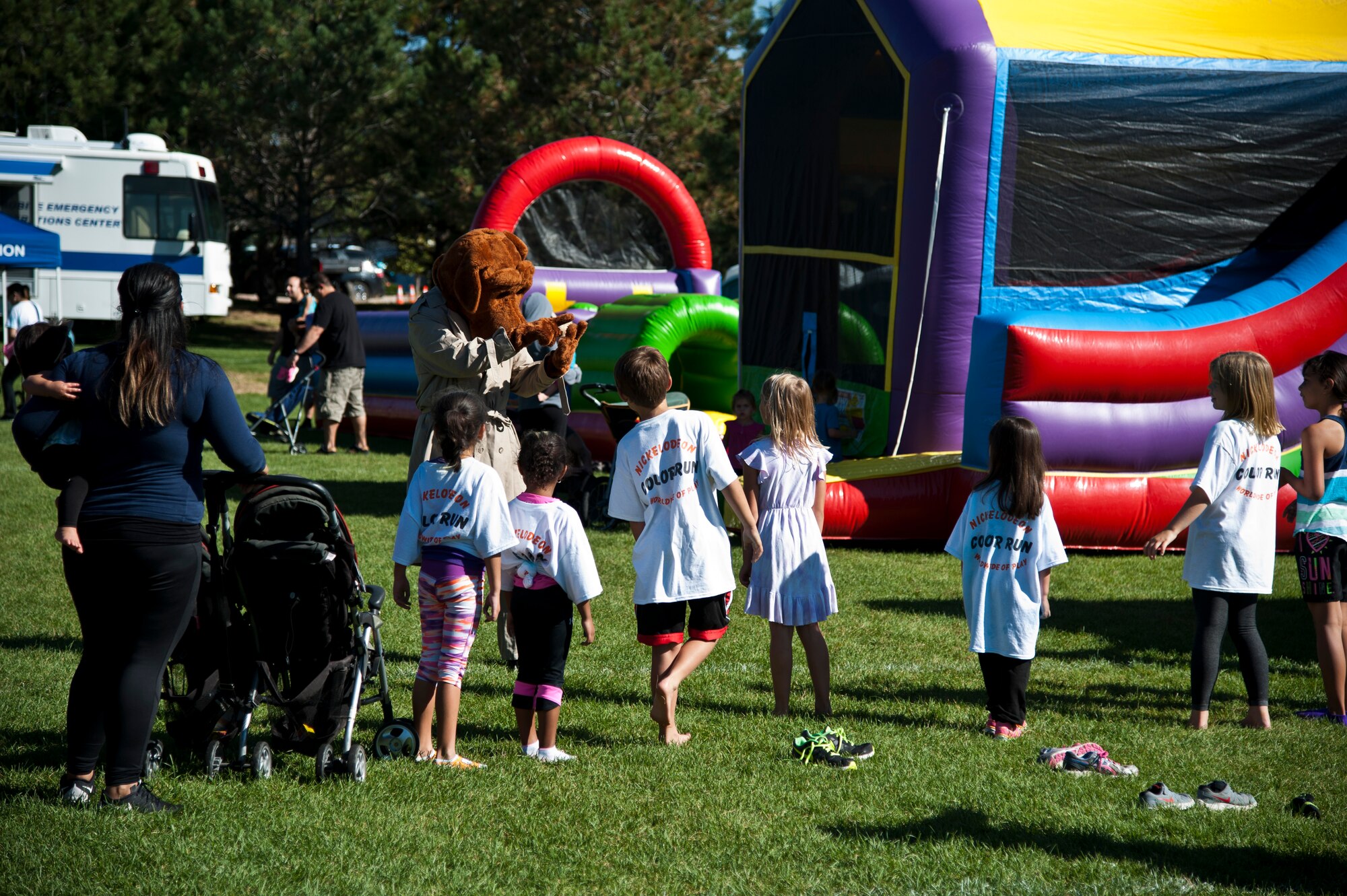PETERSON AIR FORCE BASE, Colo. – McGruff the Crime Dog teaches children about staying safe during Nickelodeon’s Worldwide Day of Play at Patriot Park, Sept. 26, 2015. The annual event included a Color Run, a pet microchipping clinic; demonstrations from the Colorado National Guard, Peterson Fire Station and Peterson’s Mobile Emergency Operations Center; and various games for families and children to enjoy. (U.S. Air Force photo by Senior Airman Tiffany DeNault)
