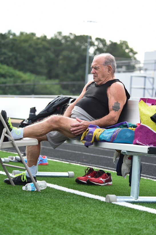 Frank Lathron, an 82 year old senior olympian, soothes his injury during the Georgia Golden Olympics Sept. 17, 2015, in Warner Robins, Ga. The Georgia Golden Olympics is a preliminary competition that allows contestants over 50 to compete against other seniors in their age group to qualify for the National Senior Olympics in Nashville, Tenn., in 2016. (U.S. Air Force photo by Senior Airman Ceaira Tinsley/ Released)