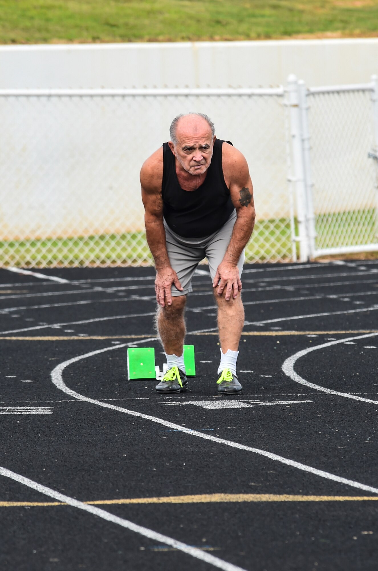 Frank Lathron, a senior olympian, prepares to sprint in the 100-meter run during the Georgia Golden Olympics Sept. 17, 2015, in Warner Robins, Ga. At 82 years old, Lathron signed up in the 81 to 85-year-old category to compete in the 50, 100 and 200-meter runs. (U.S. Air Force photo by Senior Airman Ceaira Tinsley/ Released)