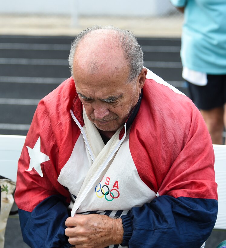 Frank Lathron, an 82-year-old senior olympian, reflects on the events of the day during the Georgia Golden Olympics Sept. 17, 2015, in Warner Robins, Ga. Lathron signed up to compete in the 50, 100, and 200-meter runs, but sustained a leg injury that eliminated him from the competition. (U.S. Air Force photo by Senior Airman Ceaira Tinsley/ Released)