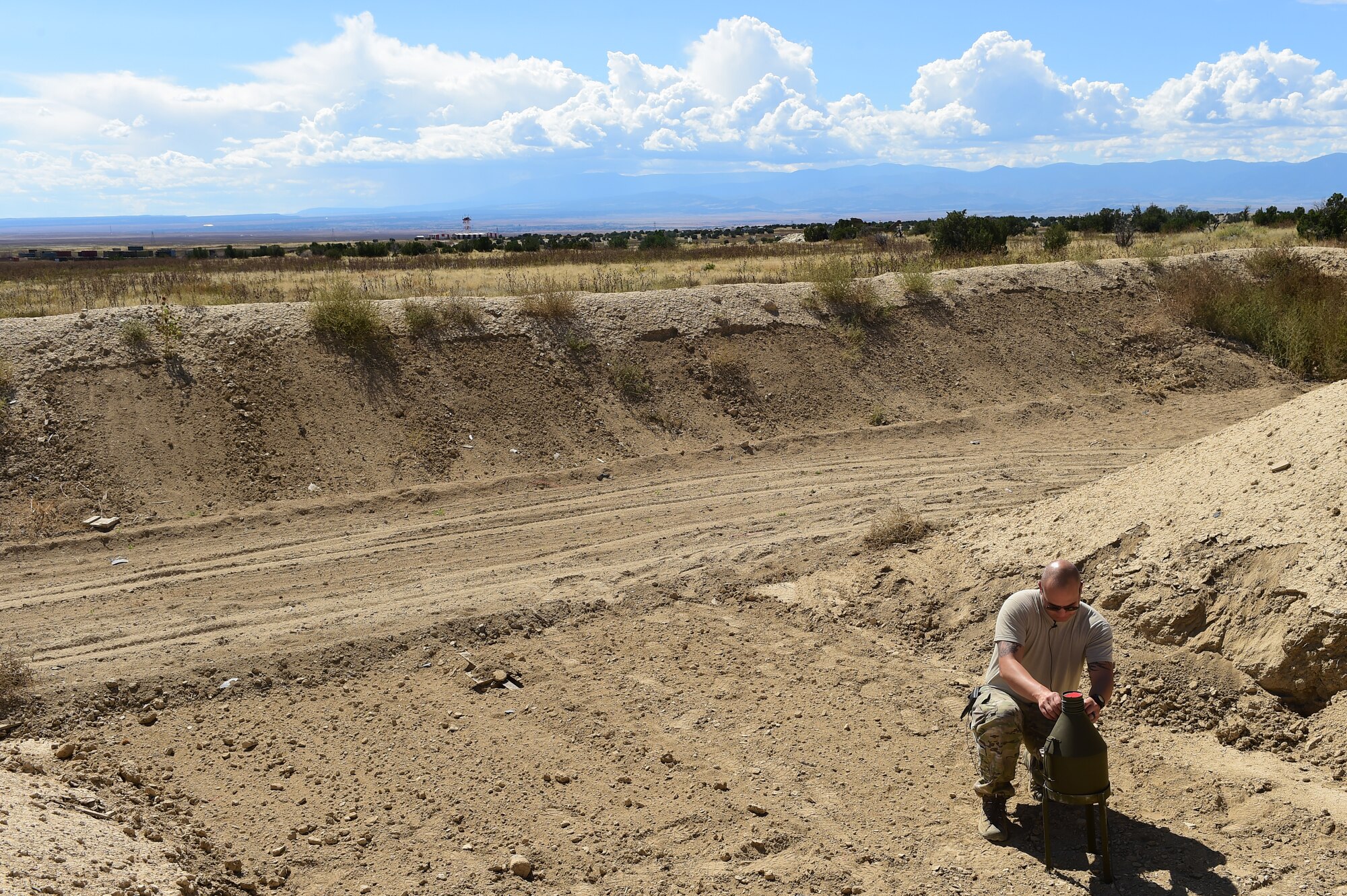 Staff Sgt. Robert Rich, 140th Explosive Ordnance Disposal operator, primes a 40-pound shape charge Sept. 23, 2015, at Airburst Range, Colo. The 140th EOD trains with a variety of explosives each month to stay proficient in their craft. (U.S. Air Force photo by Airman 1st Class Luke W. Nowakowski/Released)