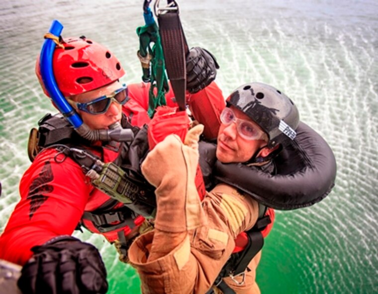 PJ's from the 920th Rescue Wing, 308th Rescue Squadron, Patrick AFB, Fl., extracted pilots from the water using two HH-60 Pave Hawks. Operators in the helos control the hoist in order to land the PJ on target for a quick rescue. (U.S. Air Force photos and graphics/Lt. Col. Jeremy Boyd)