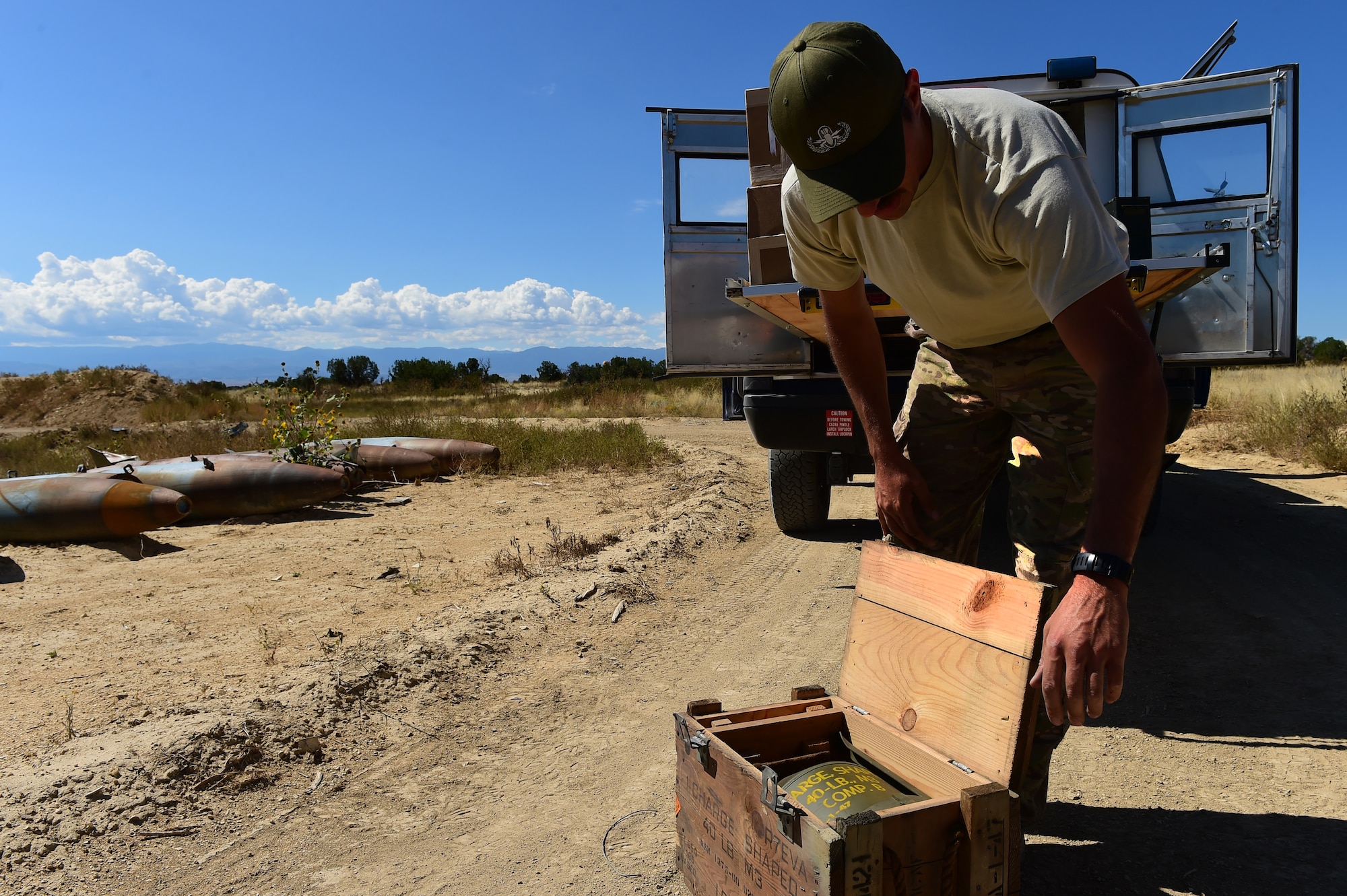 Staff Sgt. Darrel Linkus, 140th Explosive Ordnance Disposal operator, readies a 40-pound shape charge for detonation Sept. 23, 2015, at Airburst Range, Colo. The 140th EOD trains with a variety of explosives each month to stay proficient in their craft. (U.S. Air Force photo by Airman 1st Class Luke W. Nowakowski/Released)