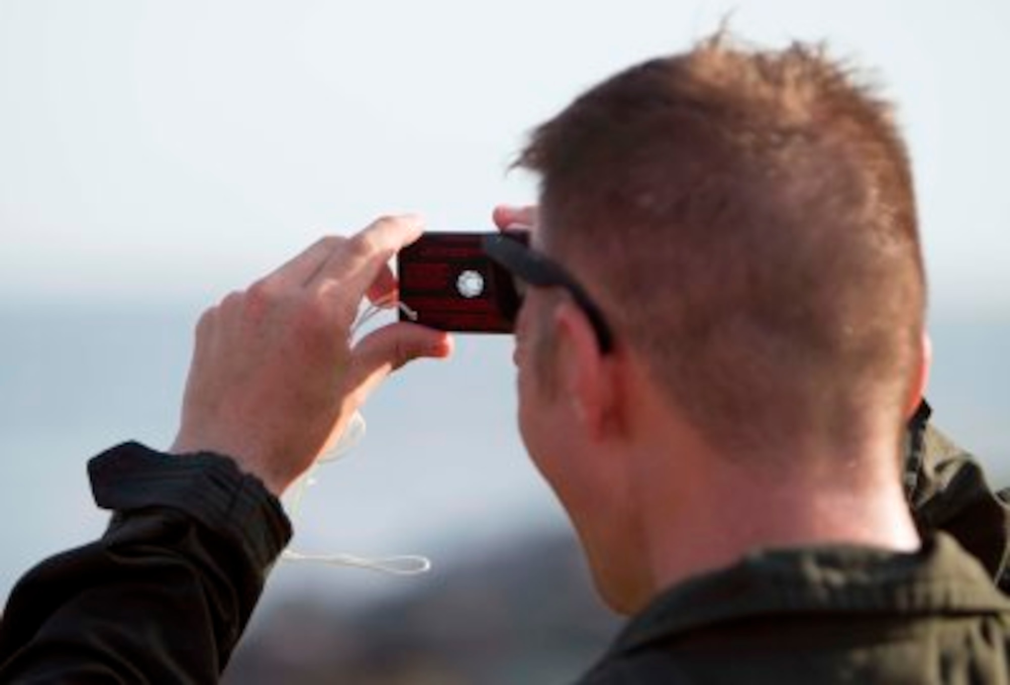 Pilots learned how to escape the entanglements of a parachute, how to communicate using a signal mirror (pictured) that can reflect sunlight up to 50 miles and how to survive in a one-man life raft until they get rescued during water survival training in Key West, Fl., Sept. 14 - 18, 2015. The signal mirror's viewing eye-hole lights up with an orange tint in order to help you focus on where you are shining the mirror. (U.S. Air Force photo/Lt. Col. Jeremy Boyd)