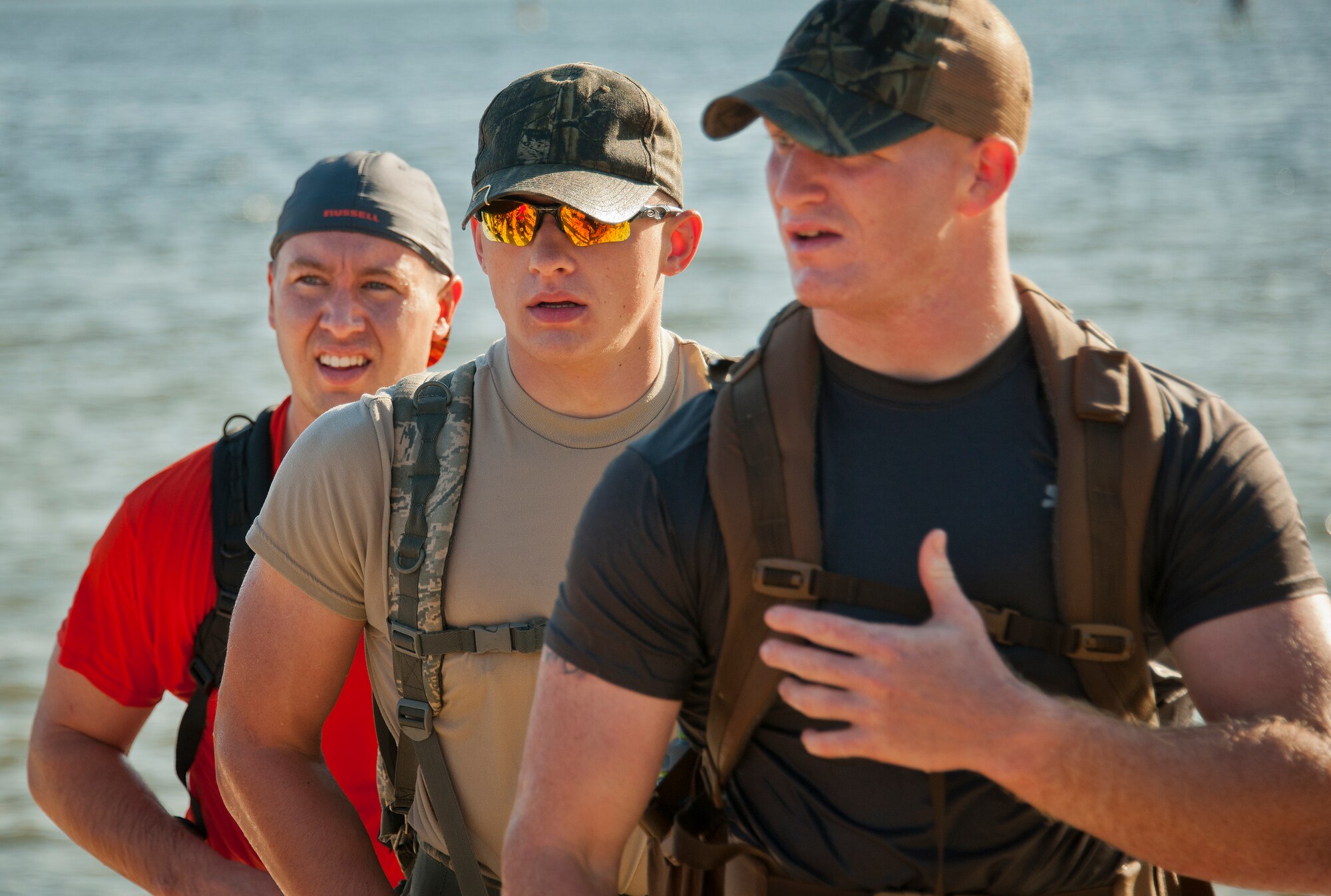 Airmen listen closely to their instructor on what to do next at the beginning of the GoRuck team building challenge Sept. 24 at Eglin Air Force Base, Fla.  More than 45 participants pushed themselves through the physical scenarios led by a Special Forces veteran, to earn the blue and black “GoRuck” patch.  (U.S. Air Force photo/Samuel King Jr.)