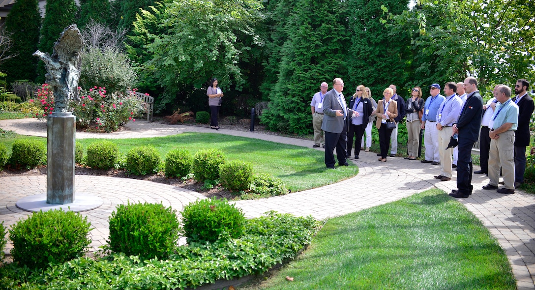 David Sparks, Senior Mortuary Chaplain at Dover Air Force Base, Del., leads a tour of civilian employers from Western New York through the Memorial Garden on Sept. 24, 2015, as part of a boss lift from Niagara Falls Air Reserve Station, N.Y. The tour was organized through the Employer Support of the Guard and Reserve, aimed to thank and educate civilian employers in Western New York who have shown support for their Military employees. (U.S. Air Force photo by Tech. Sgt. Stephanie Sawyer)
