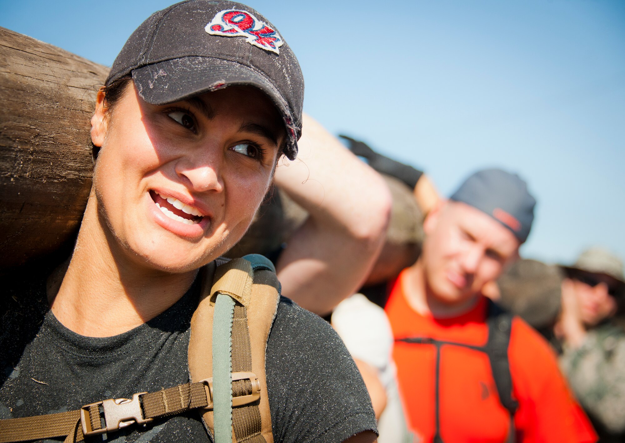 Tech. Sgt. Laisa Ramirez, 366th Training Squadron Det. 3, helps carry a wooden log during the GoRuck team building challenge Sept. 24 at Eglin Air Force Base, Fla.  More than 45 participants pushed themselves through the physical scenarios led by a Special Forces veteran, to earn the blue and black “GoRuck” patch.  (U.S. Air Force photo/Samuel King Jr.)