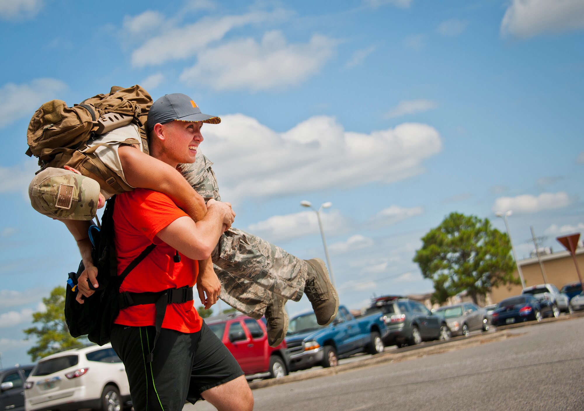 Senior Airman Thomas Church, 96th Communications Squadron, carries a simulated victim during the GoRuck team building challenge Sept. 24 at Eglin Air Force Base, Fla.  More than 45 participants pushed themselves through the physical scenarios led by a Special Forces veteran, to earn the blue and black “GoRuck” patch.  (U.S. Air Force photo/Samuel King Jr.)