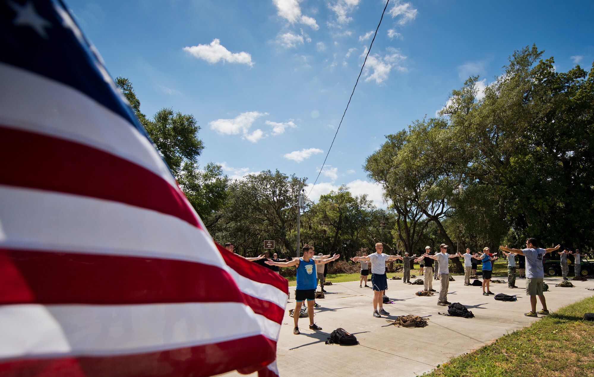 Participants complete the last of their exercises Sept. 24 at the end of the GoRuck team building challenge at Eglin Air Force Base, Fla.  More than 45 participants pushed themselves through the physical scenarios led by a Special Forces veteran, to earn the blue and black “GoRuck” patch.  (U.S. Air Force photo/Samuel King Jr.)