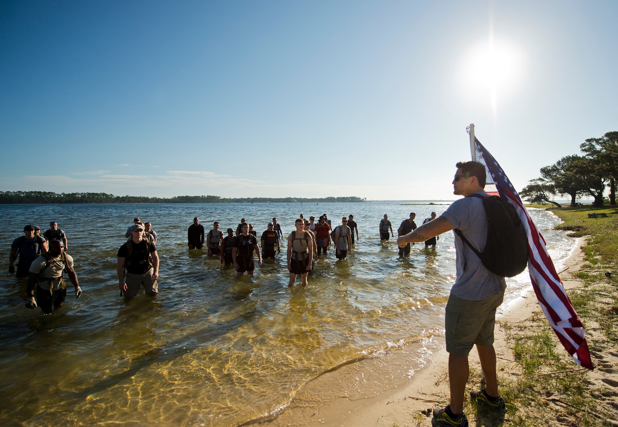 Dakotah Hayes, the GoRuck Challenge instructor, tells participants about the next exercise Sept. 24 at the GoRuck team building challenge at Eglin Air Force Base, Fla.  More than 45 participants pushed themselves through the physical scenarios led by a Special Forces veteran, to earn the blue and black “GoRuck” patch.  (U.S. Air Force photo/Samuel King Jr.)
