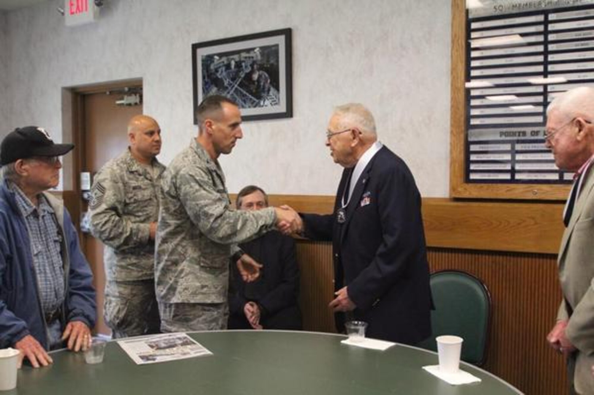 World War II POW Maj. Bob Meyer was given a POW medallion by Commander of the 62nd Airlift Wing Col. Leonard Kosinski during Joint Base Lewis-McChord’s POW/MIA Remembrance Week Luncheon Sept. 18. (Northwest Guardian photo/Christina Carmen Crea)