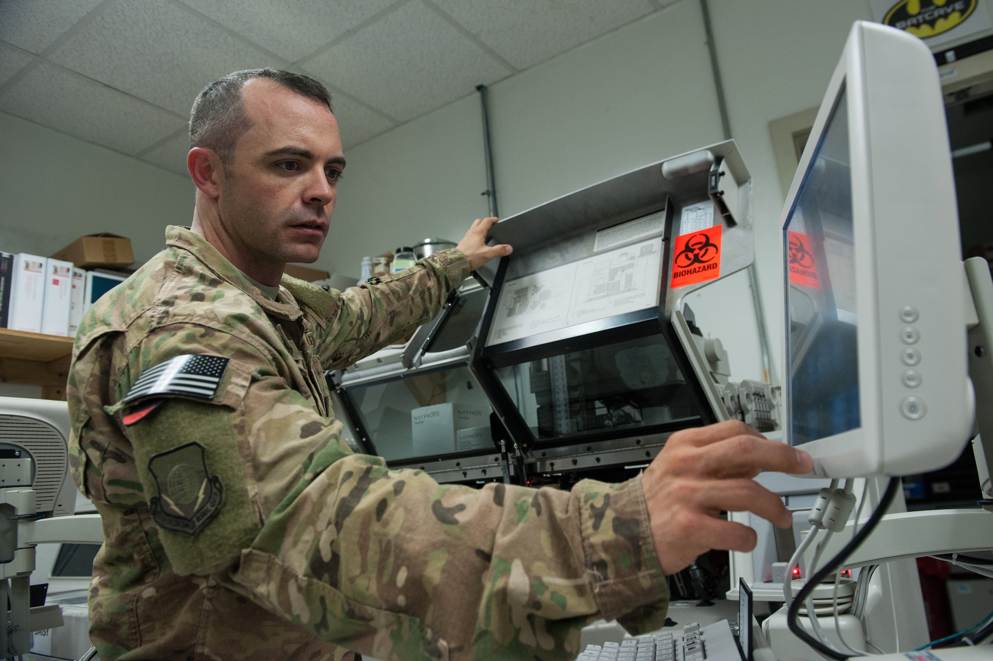 U.S. Air Force Tech. Sgt. Scott Hatch, 455th Expeditionary Medical Group biomedical equipment technician and Craig Joint Theater Hospital facility manager, performs maintenance on a blood testing machine at Bagram Air Field, Afghanistan, Sept. 24, 2015. (U.S. Air Force photo by Tech. Sgt. Joseph Swafford/Released)