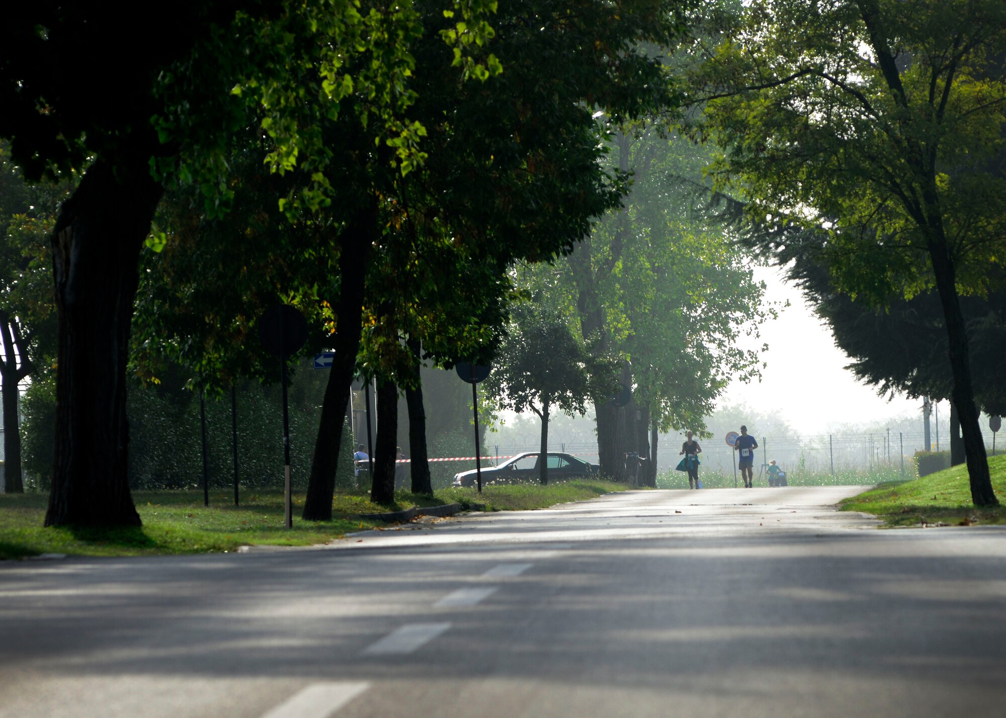 Participants take the home stretch during Team Aviano’s 9th annual Aviano Half Marathon, Sept. 9, 2015. Runners received a participation medal and the top three male and female finishers were recognized. (U.S. Air Force photo by Senior Airman Areca T. Bell/Released)
