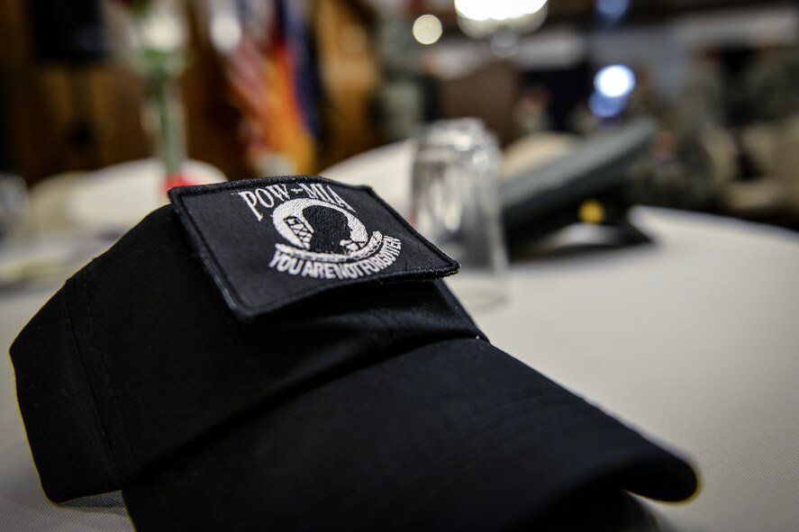 A hat sits on a table during a POW/MIA remembrance luncheon Sept. 16, 2015, at Ramstein Air Base, Germany. Place settings at an empty table were set to remember those who have been captured as prisoners of war or who are still missing. (U.S. Air Force photo/Senior Airman Nicole Sikorski)