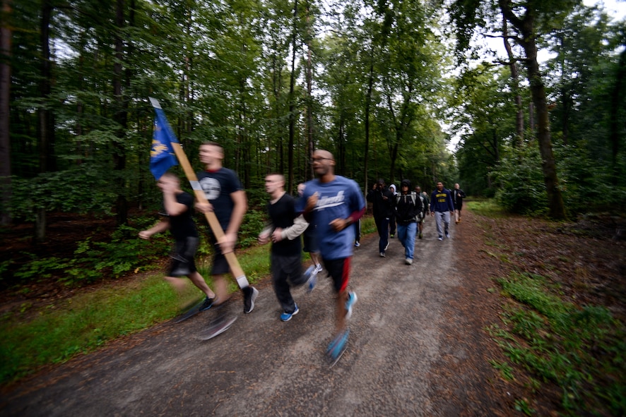 Airmen assigned to the 435th Air Ground Operations Wing and 435th Air Expeditionary Wing participate in a POW/MIA remembrance run Sept. 16, 2015, at Ramstein Air Base, Germany.  The two-day commemoration included a 5K run, a POW/MIA luncheon and a wreath-laying ceremony. (U.S. Air Force photo/Senior Airman Nicole Sikorski)