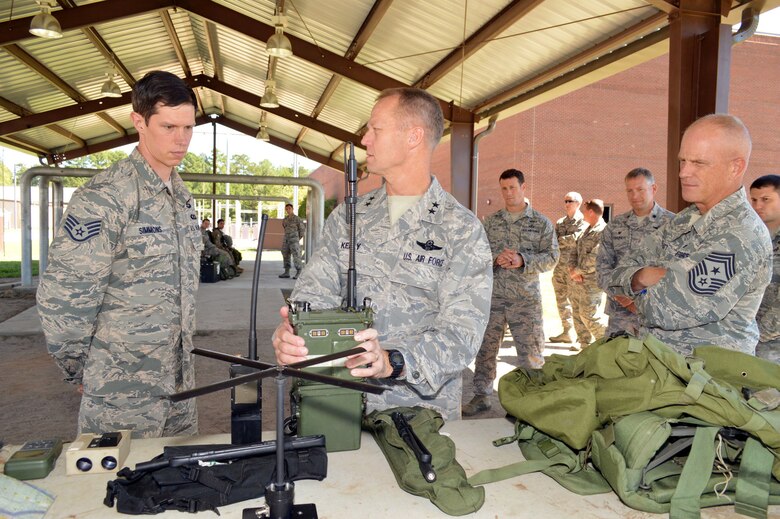 U.S. Air Force Staff Sgt. Andrew Simmons, a tactical air control party specialist assigned to the 14th Air Support Operations Squadron, briefs Maj. Gen. Mark Kelly, 9th Air Force commander, and Command Chief Master Sgt. Frank Batten III, 9th Air Force command chief, about TACP tactical equipment during Kelly’s visit with battlefield Airmen assigned to the 18th Air Support Operations Group, Pope Army Airfield, North Carolina, Sept. 14, 2015. (U.S. Air Force photo/Marvin Krause)