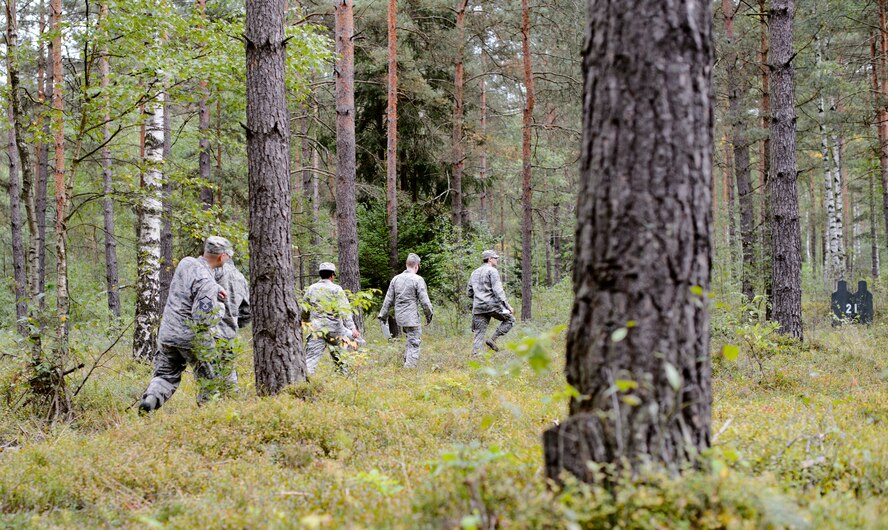 Airmen from the 7th Weather Squadron navigate through the Grafenwohr Training Area, Germany land navigation course during Cadre Focus, Sept. 16, 2015. The Airmen took part in a revamped Cadre Focus exercise designed to improve their basic Army and forecasting skills. (U.S. Air Force photo/Staff Sgt. Armando A. Schwier-Morales)