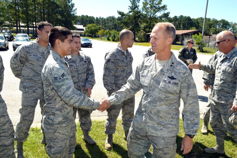 U.S. Air Force Maj. Gen. Mark Kelly, 9th Air Force commander, greets Airman 1st Class Zachary McCarthy, an RF transmissions technician assigned to the 682nd Air Support Operations Squadron, during Kelly’s visit with 18th Air Support Operations Group battlefield Airmen at Pope Army Airfield, North Carolina, Sept. 14, 2015. (U.S. Air Force photo/Marvin Krause)