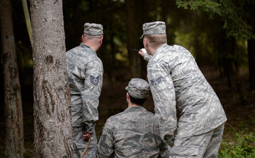 Battlefield weather Airmen enter a forest in search of a land navigation objective during an annual training exercise Sept. 16, 2015, at Grafenwohr Training Area, Germany. Battlefield weather Airmen from detachments around Europe came together for a week to train and show each other skills and abilities they had learned working side-by-side with the Army. (U.S. Air Force photo/Staff Sgt. Armando A. Schwier-Morales) 
