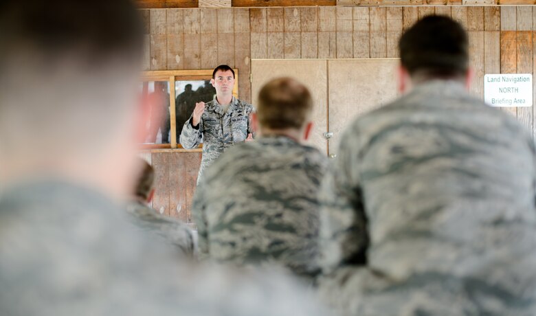 First Lt. Mitchell Westlund, 7th Weather Squadron Detachment 2 chief, briefs Airmen on land navigation during training exercise Cadre Focus Sept. 16, 2015, at Grafenwohr Training Area, Germany. Battlefield weather Airmen from the 7th WS are required to know basic Army skills such as land navigation as they are embedded within Army units throughout Europe. (U.S. Air Force photo/Staff Sgt. Armando A. Schwier-Morales)