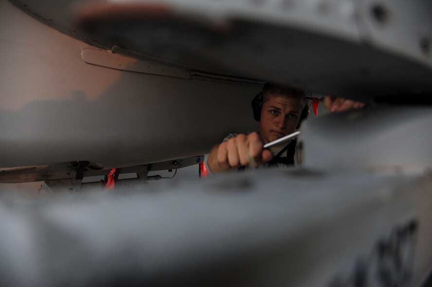 U.S. Air Force Airman 1st Class Austin Kobus, 74th Expeditionary Fighter Squadron weapons load crew member, tightens a sway brace on the Launcher Adapter Unit or LAU-117 bomb rack of an A-10 Thunderbolt II attack aircraft at Amari Air Base, Estonia, Sept. 23, 2015. Kobus is deployed from the 23rd Wing at Moody Air Force Base, Georgia, as part of a six month Theater Security Package in support of Operation Atlantic Resolve. (U.S. Air Force photo by Andrea Jenkins/Released)