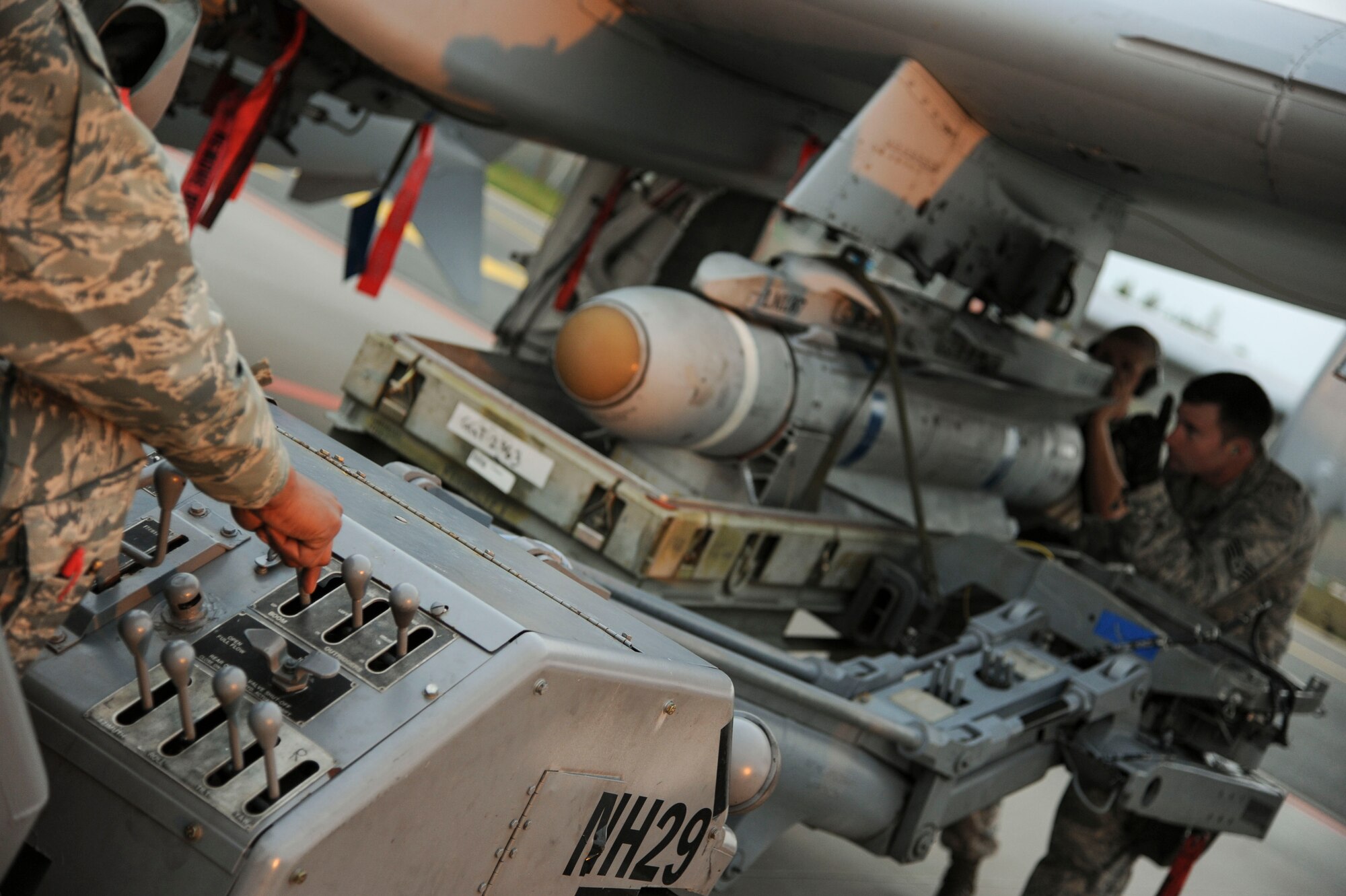 74th Expeditionary Fighter Squadron weapons load crew team work together to load a Training Guided Missile on a U.S. Air Force A-10 Thunderbolt II attack aircraft prior to the first training mission at Amari Air Base, Estonia, Sept. 23, 2015. This is the first deployment for each member of this three-person crew who are deployed from the 23rd Wing at Moody Air Force Base, Georgia.