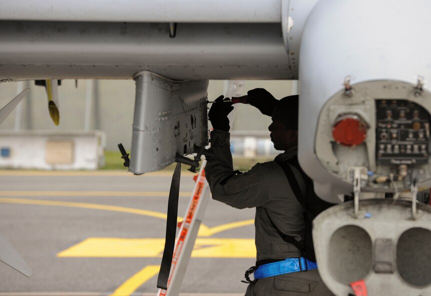 Senior Airman Tayrell Washington, 74th Expeditionary Fighter Squadron weapons load crew team member, secures a pylon door on an U.S. Air Force A-10 Thunderbolt II attack aircraft on the flightline at Amari Air Base, Estonia, Sept. 21, 2015. The aircraft and Airmen will forward deploy to locations in Eastern Europe and work alongside NATO allies as part of a Theater Security Package in support of Operation Atlantic Resolve. (U.S. Air Force photo by Andrea Jenkins/Released)