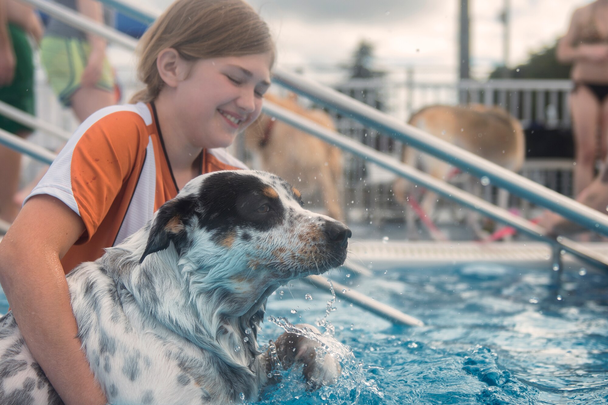 A dog and its owner swim during the Dog Days of Summer event held at Yokota Air Base, Japan, Sept. 26, 2015. The event is held on the last day of the pool's opening to celebrate the last day of summer. (U.S. Air Force photo by Airman 1st Class Delano Scott/Released)