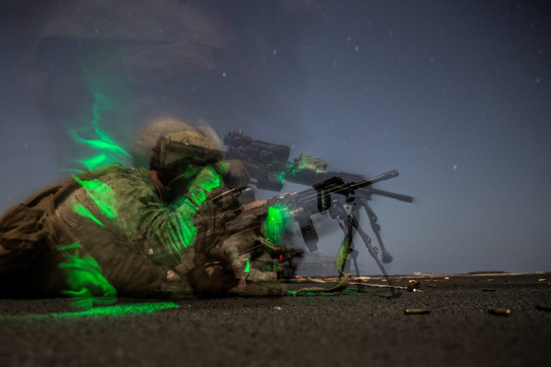 INDIAN OCEAN (Sept. 24, 2015) U.S. Marine Cpl. Joseph Varley has his rifle cleared during a marksmanship qualification course aboard the dock landing ship USS Rushmore (LSD 47). Varley is an assault man with Kilo Company, Battalion Landing Team 3rd Battalion, 1st Marine Regiment, 15th Marine Expeditionary Unit. The marksmanship course focused on sharpening basic marksmanship skills under the cover of darkness which prepares them for potential operations while deployed with the 15th MEU. The 15th MEU, embarked aboard the ships of the Essex Amphibious Ready Group, is deployed to maintain regional security in the U.S. 5th Fleet area of operations. (U.S. Marine Corps photo by Sgt. Emmanuel Ramos/Released)