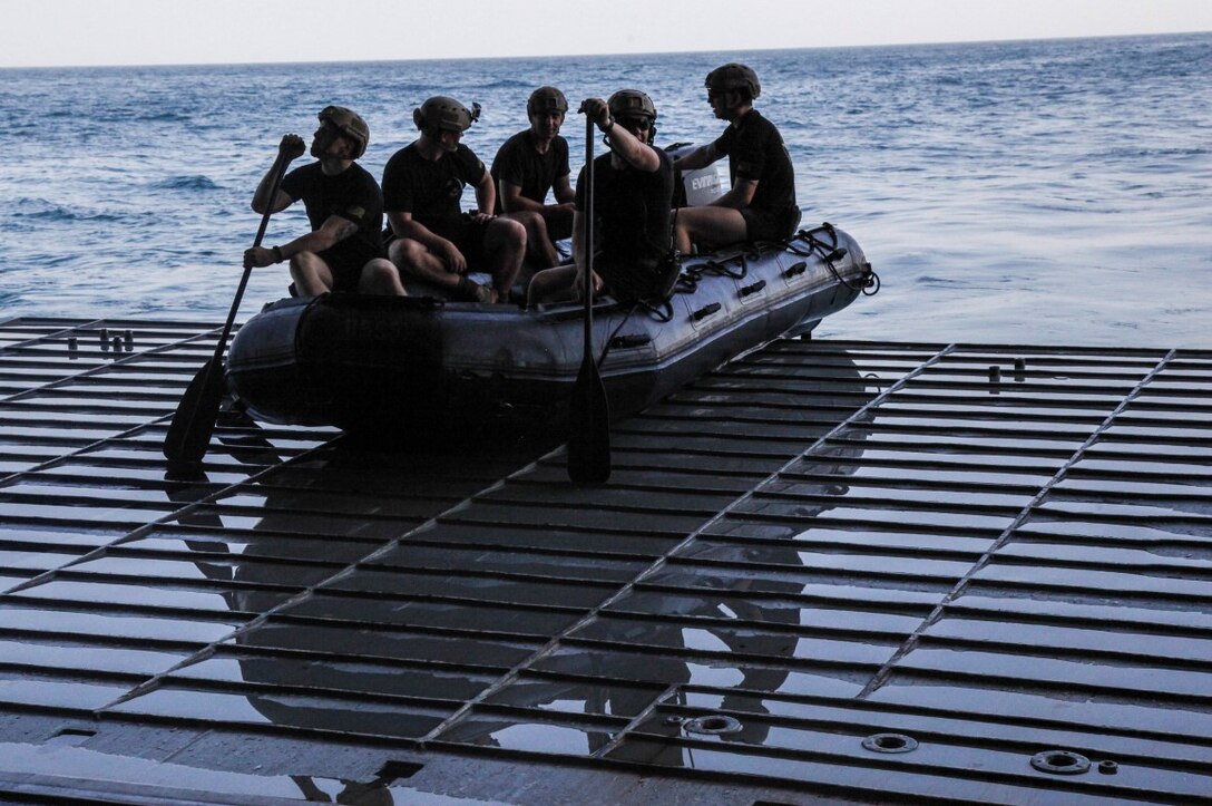 ARAIBIAN GULF (Sept. 26, 2015) U.S. Marines with the 15th Marine Expeditionary Unit’s Maritime Raid Force depart in combat rubber raiding craft from the well deck of the amphibious assault ship USS Essex (LHD 2). The MRF tested the engines of their CRRC’s in order to maintain combat readiness. The 15th MEU, embarked aboard the ships of the Essex Amphibious Ready Group, is deployed to maintain regional security in the U.S. 5th Fleet area of operations. (U.S. Marine Corps photo by Cpl. Elize McKelvey/Released)