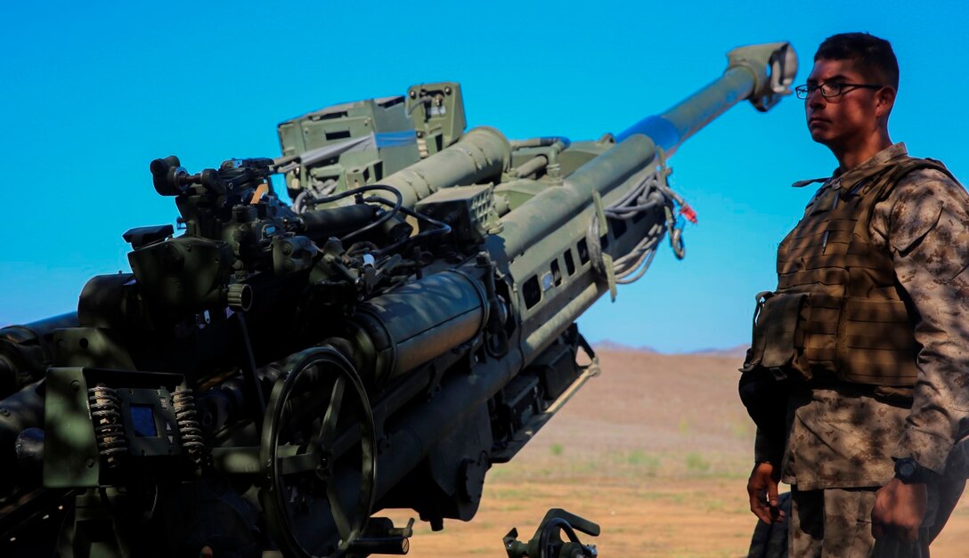 Pfc. Jonathan Linares, a gunner with Battery F, 2nd Battalion, 11th Marine Regiment, 1st Marine Division, I Marine Expeditionary Force, stands ready for the next fire mission of his team’s M777 howitzer aboard Marine Corps Base Camp Pendleton, Calif., Sept. 23, 2015. Processing fire missions is one of the most important forms of training for an artillery team. (U.S. Marine photo by Pvt. Robert Bliss/Released)