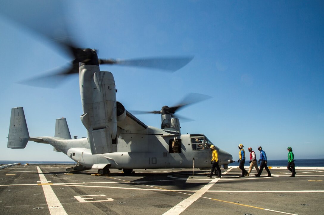 Marines and Sailors prepare to detach the MV-22 Osprey for departure from the USS New Orleans during the PHIBRON-MEU integration exercise aboard the USS New Orleans on Sept. 25, 2015. This marks the first at sea exercise for the PHIBRON-MEU Marines and Sailors as they work together in preparation for deployment to the Pacific and Central Command areas of responsibility in early 2016. (U.S. Marine Corps photo by Sgt. Hector de Jesus/Released)
