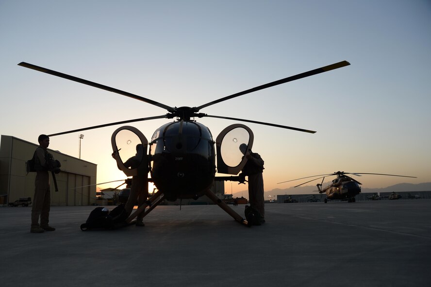 Afghan Air Force pilots perform pre-flight inspections prior to an all-Afghan combat mission. The crews flew out of Hamid Karzai International Airport, Kabul, Afghanistan, Sept. 27, 2015. (U.S. Air Force photo by Staff Sgt. Sandra Welch/released)