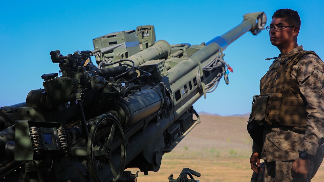 Pfc. Jonathan Linares, a gunner with Battery F, 2nd Battalion, 11th Marine Regiment, 1st Marine Division, I Marine Expeditionary Force, stands ready for the next fire mission of his team’s M777 howitzer aboard Marine Corps Base Camp Pendleton, Calif., Sept. 23, 2015. Processing fire missions is one of the most important forms of training for an artillery team. 