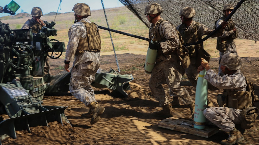 Marines with Battery F, 2nd Battalion, 11th Marine Regiment, 1st Marine Division, I Marine Expeditionary Force prepare to load a round into their team’s M777 howitzer for their fire mission aboard Marine Corps Base Camp Pendleton, Calif., Sept. 23, 2015. Processing fire missions is one of the most important forms of training for an artillery team. 