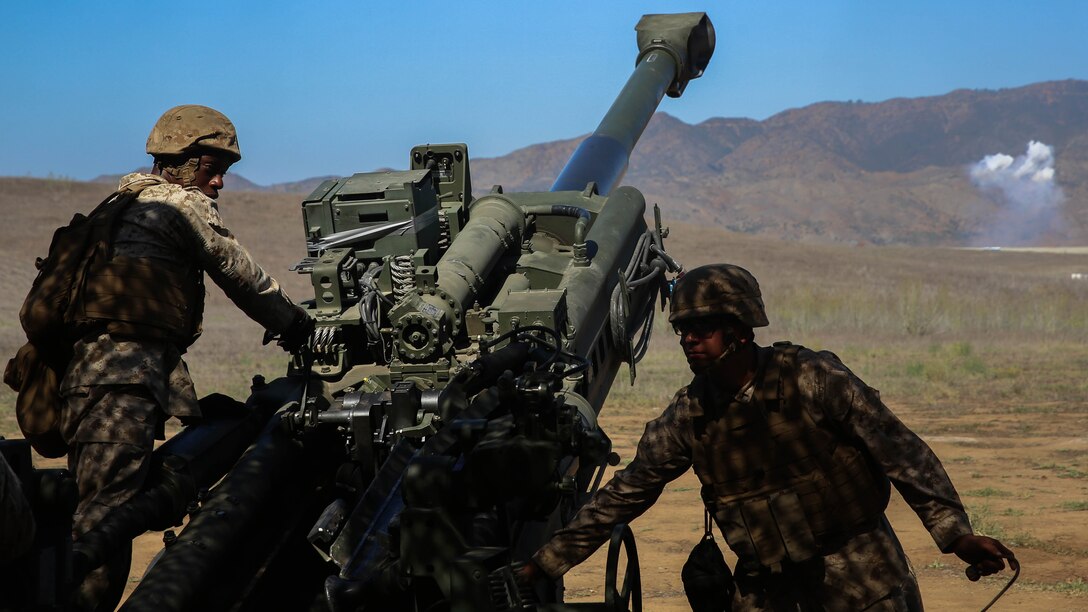 Marines with Battery F, 2nd Battalion, 11th Marine Regiment, 1st Marine Division, I Marine Expeditionary Force fire their team’s M777 howitzer at a targeted quadrant for their fire mission aboard Marine Corps Base Camp Pendleton, Calif., Sept. 23, 2015. Processing fire missions is one of the most important forms of training for an artillery team.