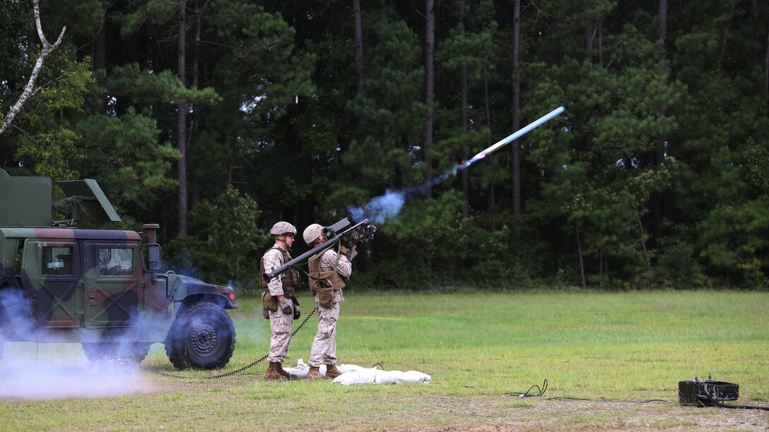 A Marine fires a dummy round into the air during a stinger simulation training range at Marine Corps Air Station Cherry Point, North Carolina, Sept. 24, 2015. Marines with 2nd Low Altitude Air Defense Battalion sharpened their proficiency skills by simulating the weight transfer felt when firing the 34.2 pound missile. The weapon is a personal and portable infrared, homing, surface-to-air missile capable of tracking and engaging aircraft up to an altitude of 10,000 feet and covering distances up to eight kilometers. 2nd LAAD utilizes the stinger missile to provide ground-to-air defense to the 2nd Marine Aircraft Wing and Marine Air-Ground Task Force elements.