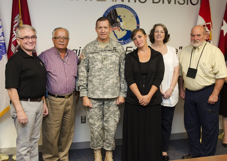Lawrence "Larry" Robinson, civil engineer; Fidel Rodriguez, general engineer; Kirsten Smyth, deployment coordination administrator; Colleen Haney, administrative officer; and Michael Callaway, civil engineer, members of the UCRC, received commander's coins from Maj. Gen. Robert D. Carlson, TAD commander, at the Transatlantic Division’s office in Winchester, Va. on Sept. 24 in recognition of their efforts for contributing to over 900 overseas civilian hires since 2011.