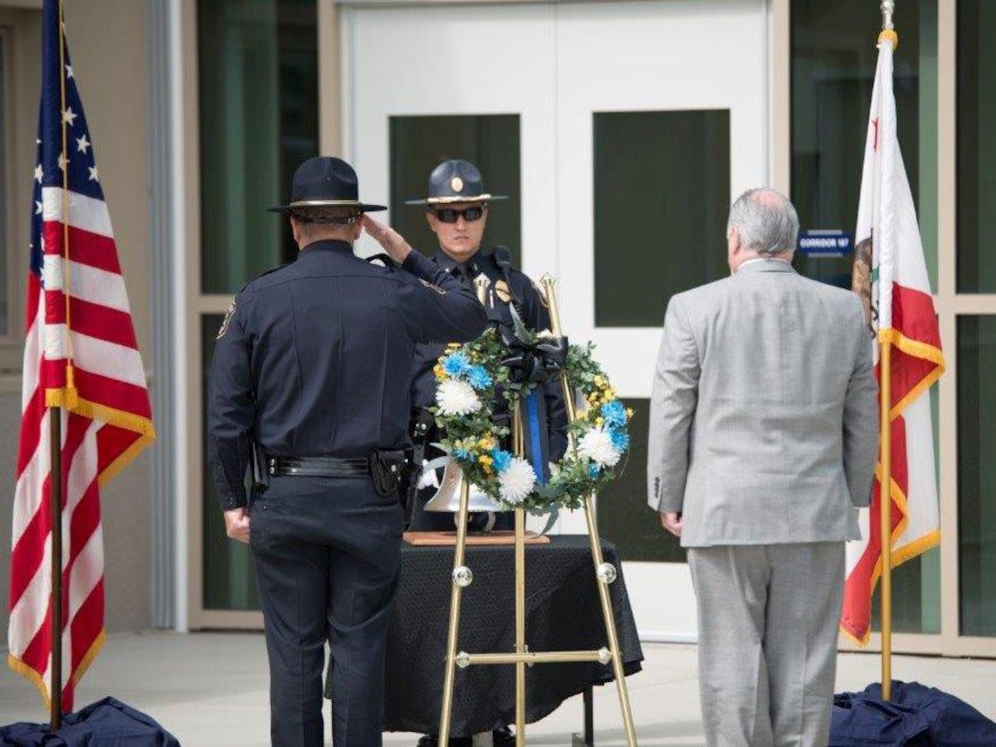 DLA Installation Support San Joaquin police chief John Vieira and site director Jonathan Mathews lay the wreath at the base of the ceremonial bell in honor of law enforcement officers killed in the line of duty.  