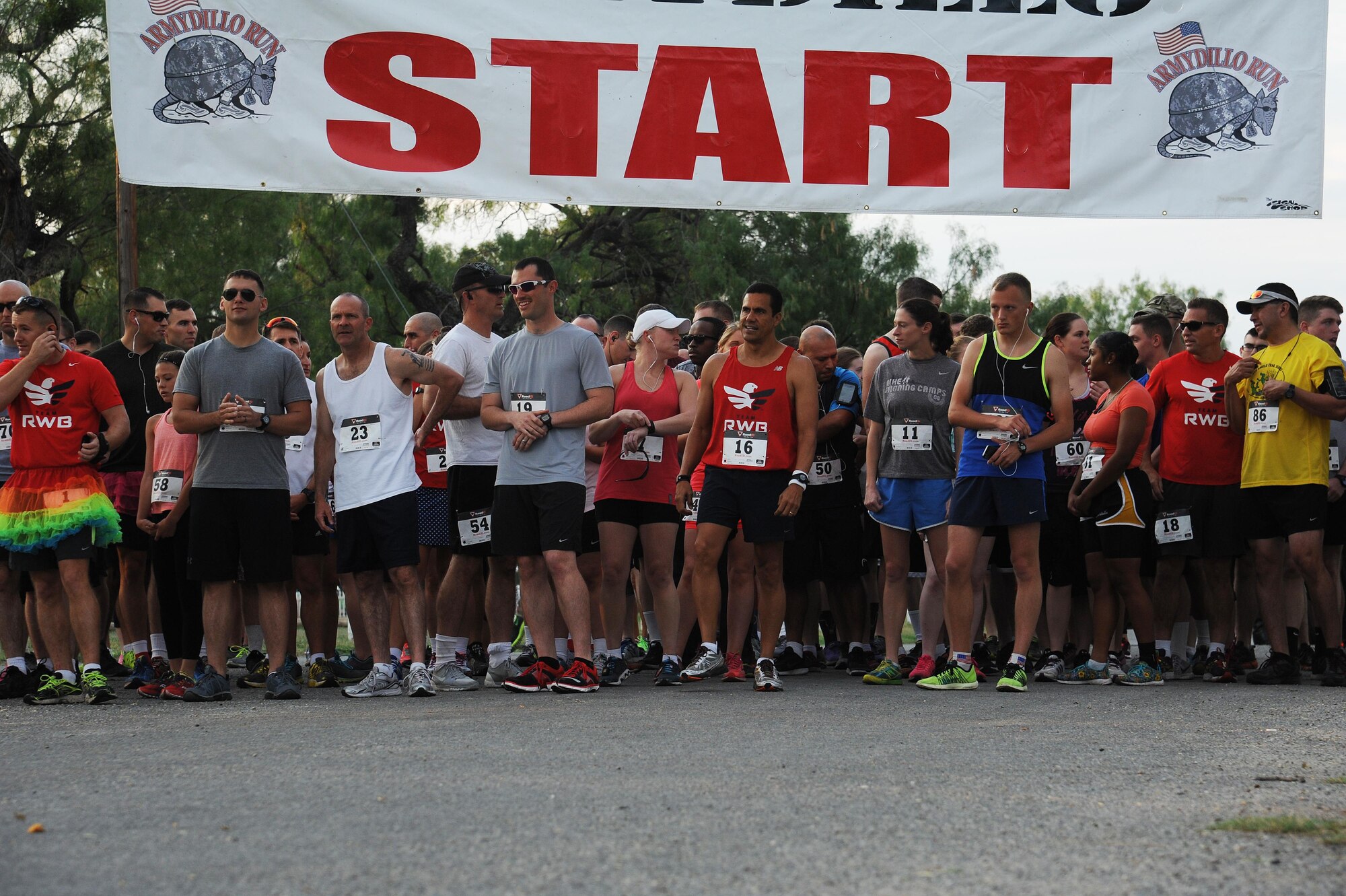 Participants of the 21st Annual Armydillo Run crowd the start line in anticipation for the following 10 K in San Angelo, Texas, Sept. 26, 2015. A total of 182 participants, from both Goodfellow Air Force Base and the San Angelo community, registered for the Armydillo run. (U.S. Air Force photo by Airman Caelynn Ferguson/Released)