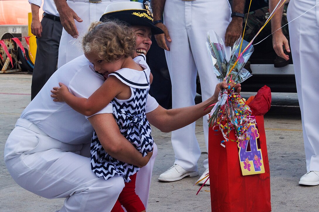 A daughter greets her mother after the Military Sealift Command hospital ship USNS Mercy returns to homeport on Naval Base San Diego, Calif., Sept. 27, 2015. The Mercy completed a nearly five-month deployment to support Pacific Partnership 2015. U.S. Navy photo by Petty Officer 3rd Class Eric Coffer
