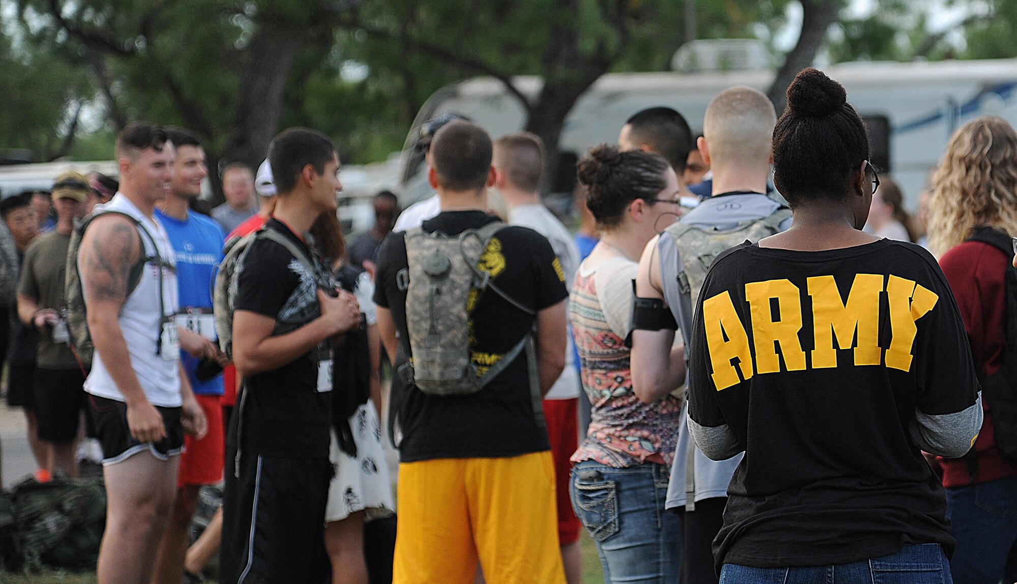 A volunteer for the 21st Annual Armydillo Run dons a custom Army t-shirt for the event at Spring Creek Marina, San Angelo, Texas, Sept. 26, 2015. Volunteers for the event helped set up, distribute food and water and tear down the event once it was over. (U.S. Air Force photo by Airman Caelynn Ferguson/Released)