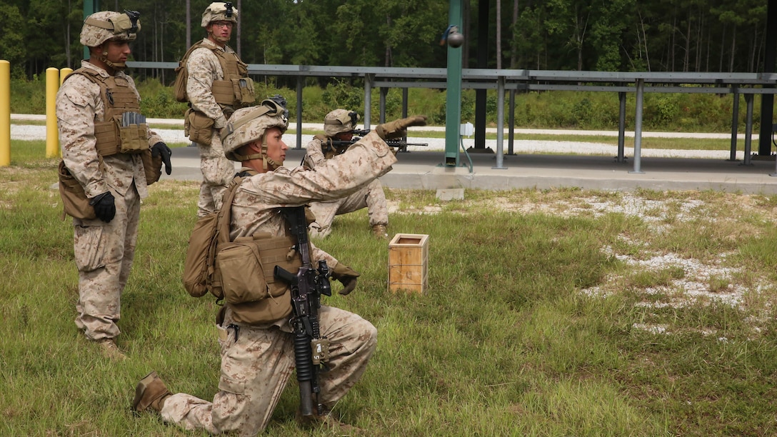 A Marine with 1st Battalion, 6th Marine Regiment throws a practice grenade at a practice target during live fire training aboard Camp Lejeune, N.C., Sept. 22 – 23, 2015. During the training the Marines were instructed to fire at practice targets at an unknown distance in order to improve their accuracy and marksmanship skills. 