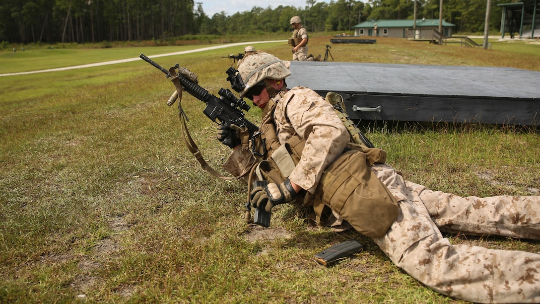 A Marine with 1st Battalion, 6th Marine Regiment reloads an M4 carbine during live fire training aboard Camp Lejeune, N.C., Sept. 22 – 23. During the training, the Marines were instructed to fire at practice targets at an unknown distance in order to improve their accuracy and marksmanship skills. 