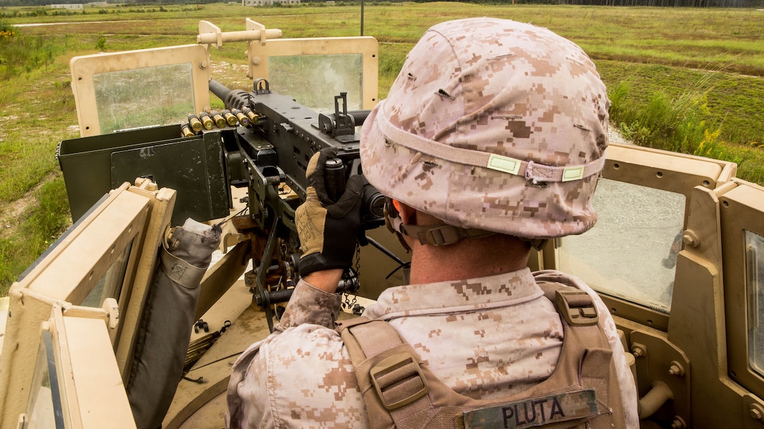 Lance Cpl. Andrew Pluta, a machine gunner with 1st Battalion, 8th Marine Regiment, fires the M2 .50 caliber heavy machine gun during company sized combined arms attacks on range SR9 at Marine Corps Base Camp Lejeune, N.C., Sept. 24, 2015. During the training, Alpha Company fired the M4 carbine, the M16 A4 service rifle, M249 Squad Automatic Weapons, M240B machine guns, M2 .50 caliber heavy machine guns, MK19 40mm grenade launchers and M224 60mm lightweight mortar systems. 