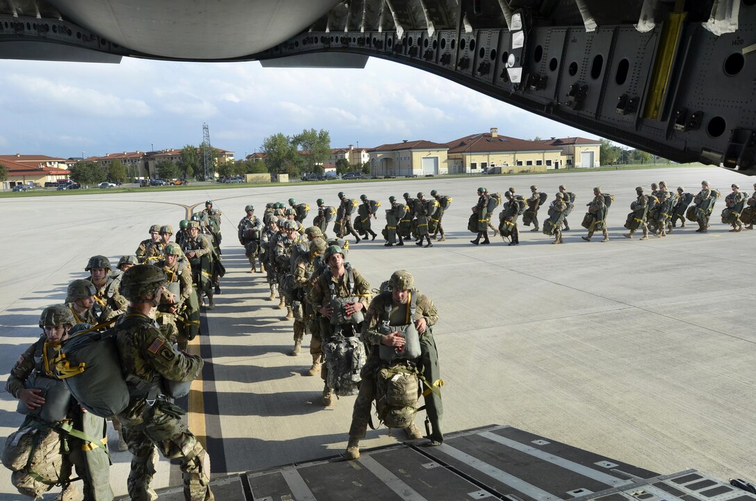 U.S. and Hungarian paratroopers move to an awaiting U.S. Air Force C-17 Globemaster before participating in a combined airborne operation into Hungary as part of Exercise Brave Warrior on Aviano Air Base, Italy, Sept. 16, 2015. U.S. Army photo by Sgt. A.M. LaVey 