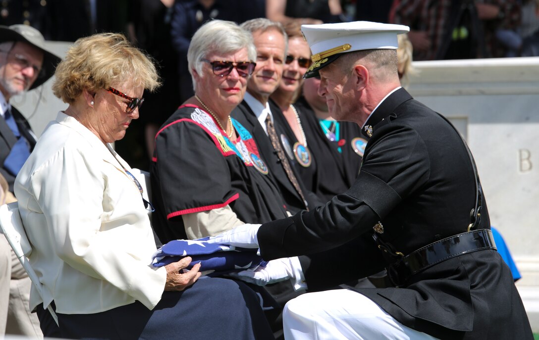 Maj. Gen. Burke Whitman, Headquarters Marine Corps director of Marine and family readiness, presents the American flag to the family of 1st Lt. Alexander Bonnyman Jr. at Berry Highland Memorial Cemetery in Knoxville, Tenn., on Sept. 27, 2015. Bonnyman joined Marine Forces Reserve in July 1942 and was killed while fighting in the battle of Tarawa in 1943. Bonnyman’s remains were discovered in Tarawa 72 years after he was buried there.